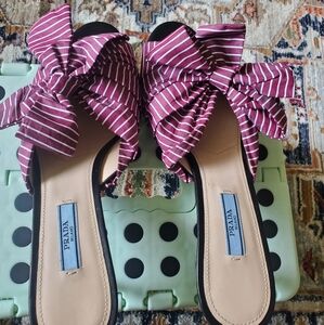 Burgundy with white stripes Prada sandals.